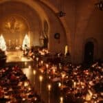 Masses lighting candles at church.