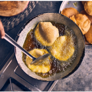 Poori in a pan with oil