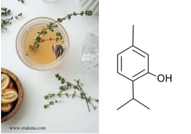  A bowl containing yellow liquid and green stem, and chemical formula