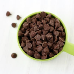 Dairy-free chocolate chips placed in a container